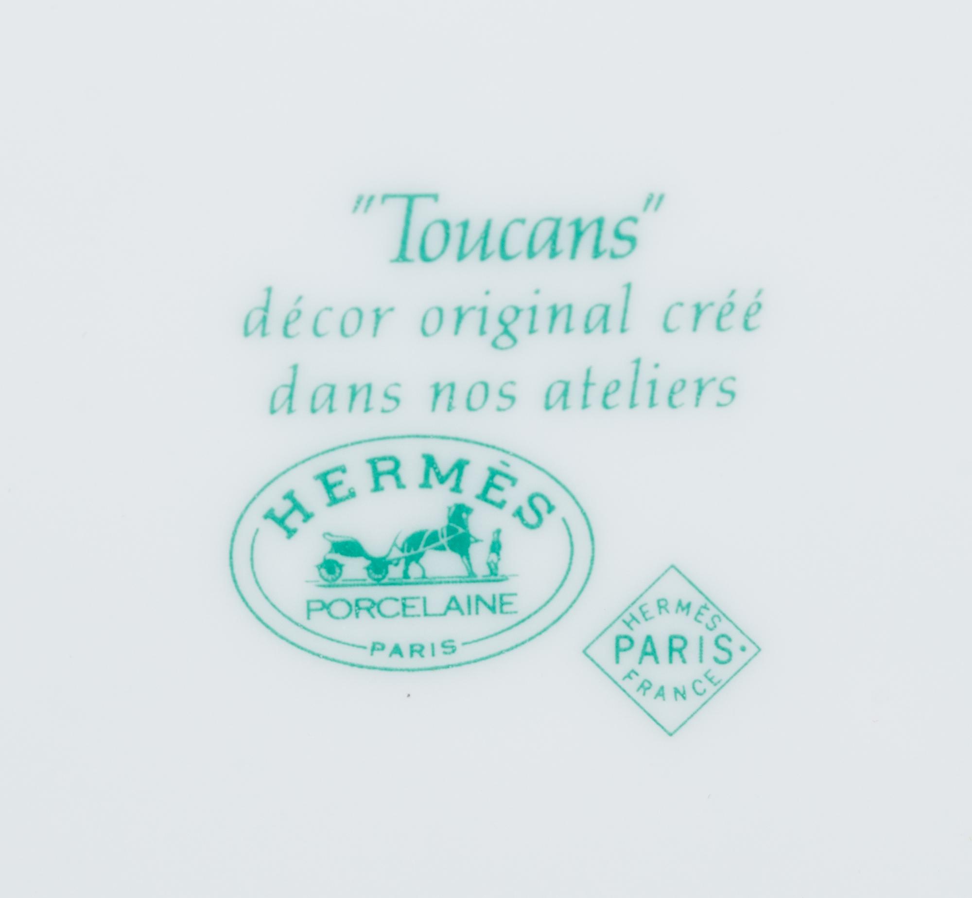 An Hermès Porcelain Toucans Porcelain Dinner Service