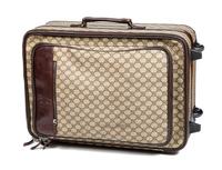 A Gucci Monogram Canvas Roller Suitcase, 22" H x 15.25" W x 9.25" D; Handle: 1.25".