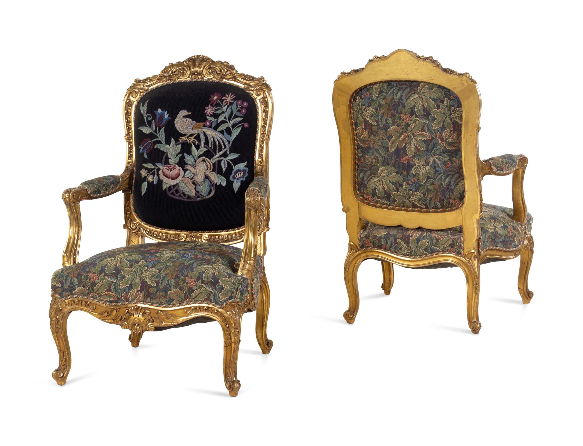 A Pair of Louis XV Style Carved Giltwood Fauteuils