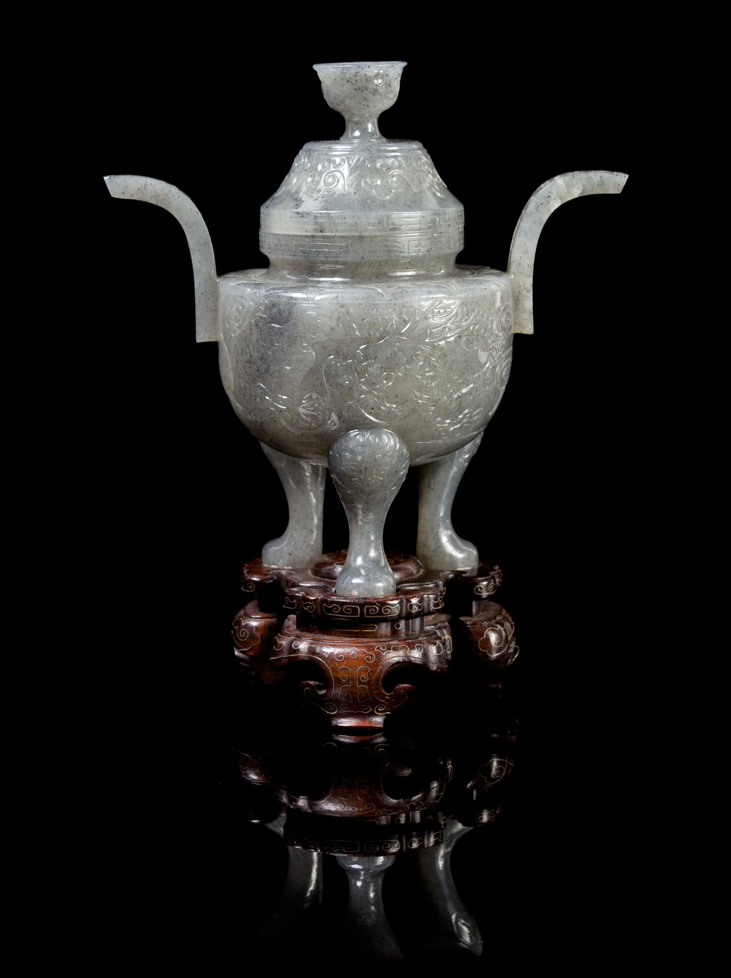 A Chinese Carved Jade Tripod Censer EARLY 20TH CENTURY Height with stand 7 1/2 x width at handles 6 inches. — EARLY 20TH CENTURY