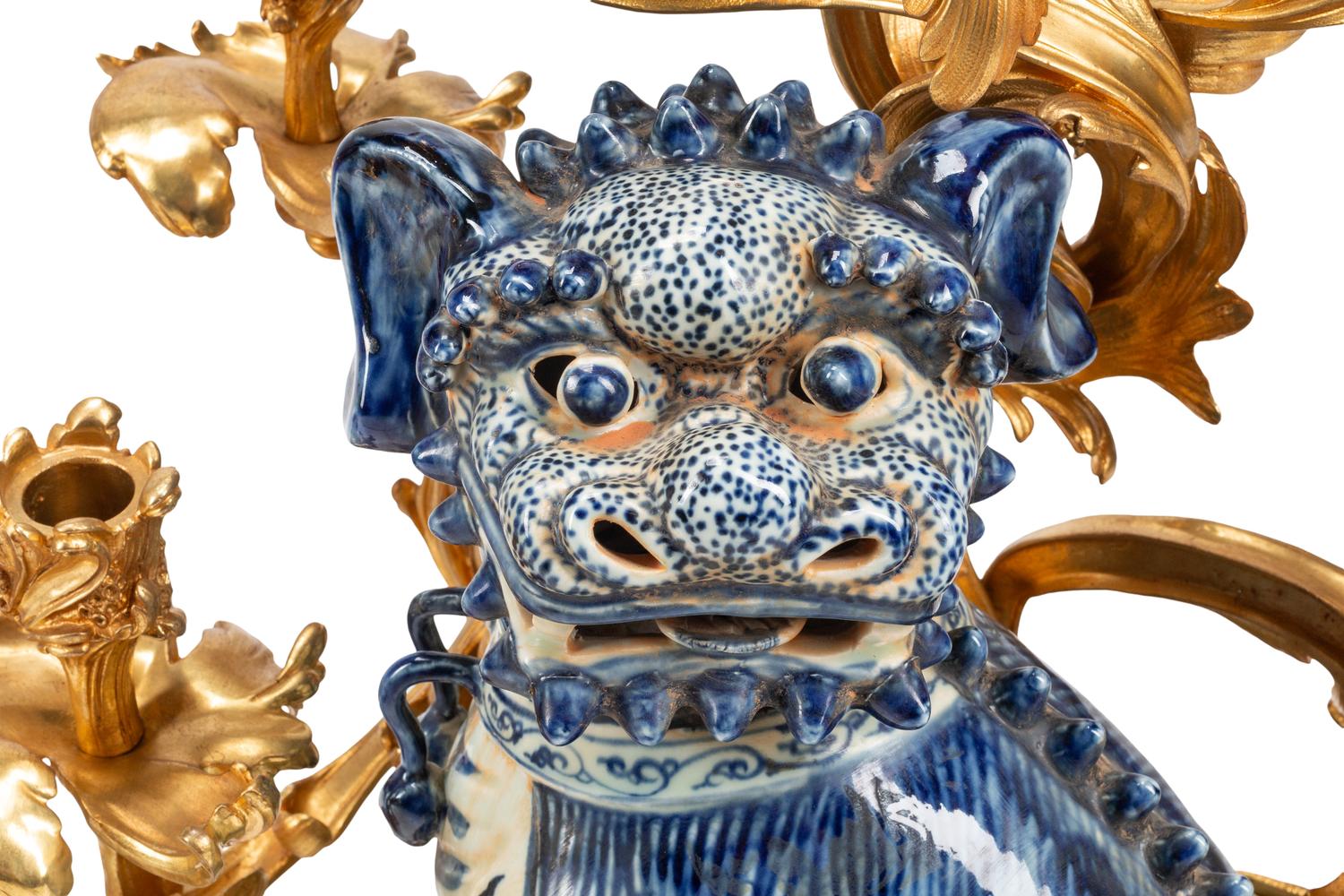 A Pair of Large Gilt Bronze Mounted Porcelain Temple Lion Candelabra