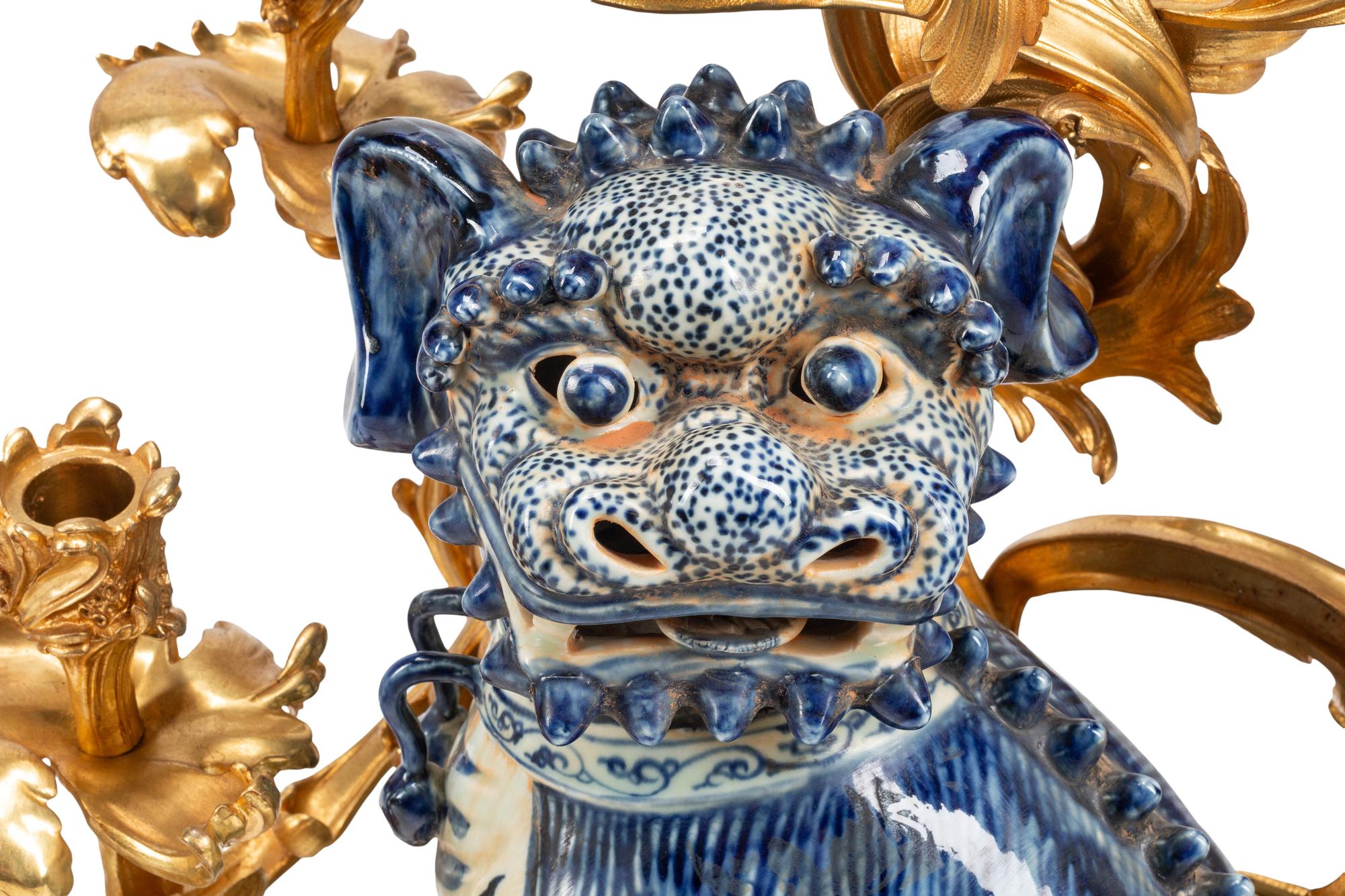 A Pair of Large Gilt Bronze Mounted Porcelain Temple Lion Candelabra