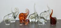 A Group of Eight Glass Elephant Figures Height of tallest 14 1/4 inches.