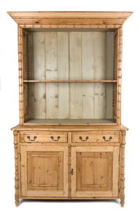 A Regency Style Stained Pine and Bamboo Bookcase Height 87 x width 51 x depth 25 inches.
