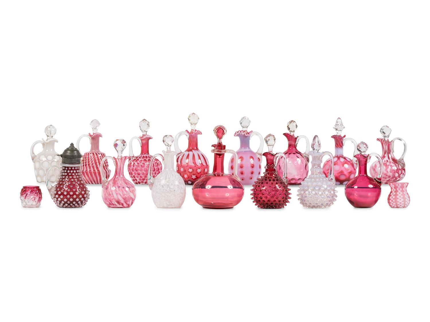 Seventeen Cranberry and Opal Glass Cruets, Toothpick Holders and a Syrup