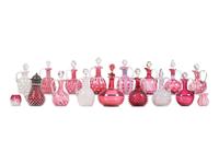 Seventeen Cranberry and Opal Glass Cruets, Toothpick Holders and a Syrup