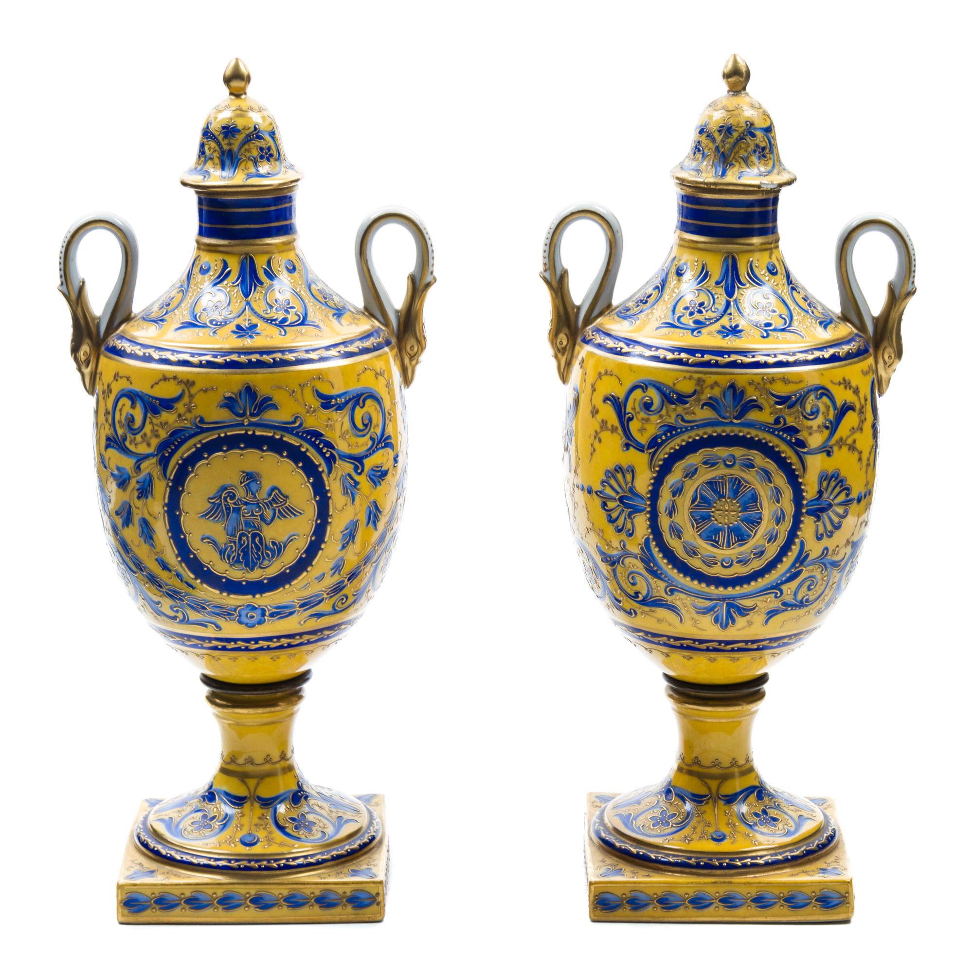 A Pair of Sevres Style Porcelain Urns Height 11 1/2 inches.