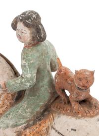 A Chinese Painted Pottery Figure of an Equestrienne with a Leopard