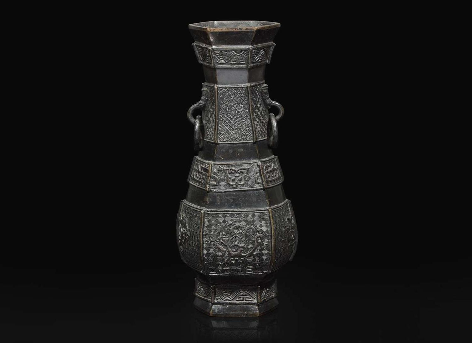 A Chinese patinated bronze hexagonal vase, Yuan to Ming Dynasty 加漆六方銅瓶 元或明