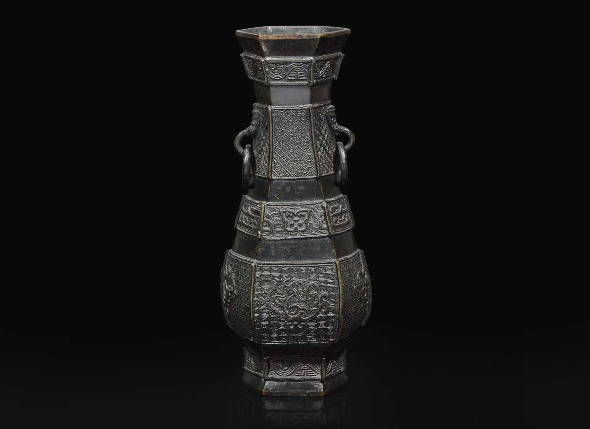 A Chinese patinated bronze hexagonal vase, Yuan to Ming Dynasty 加漆六方銅瓶 元或明