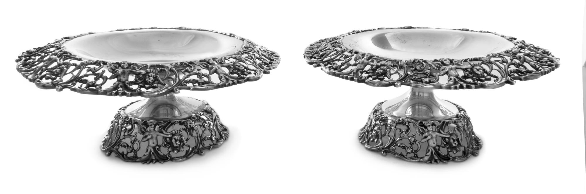 A Pair of American Silver Tazze, Durham Silver Co., New York, NY , each pierced border and foot worked to show cherubs among floral and