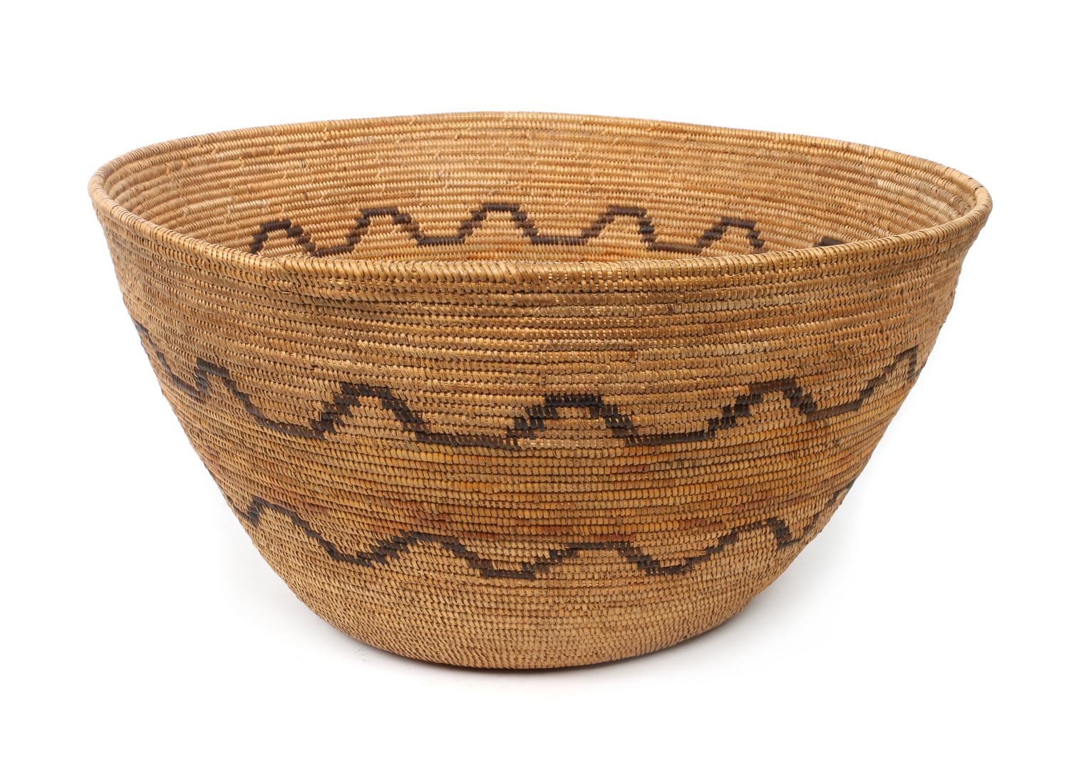A Mission Indian Basket Bowl Height 10 1/2 x diameter 20 inches.