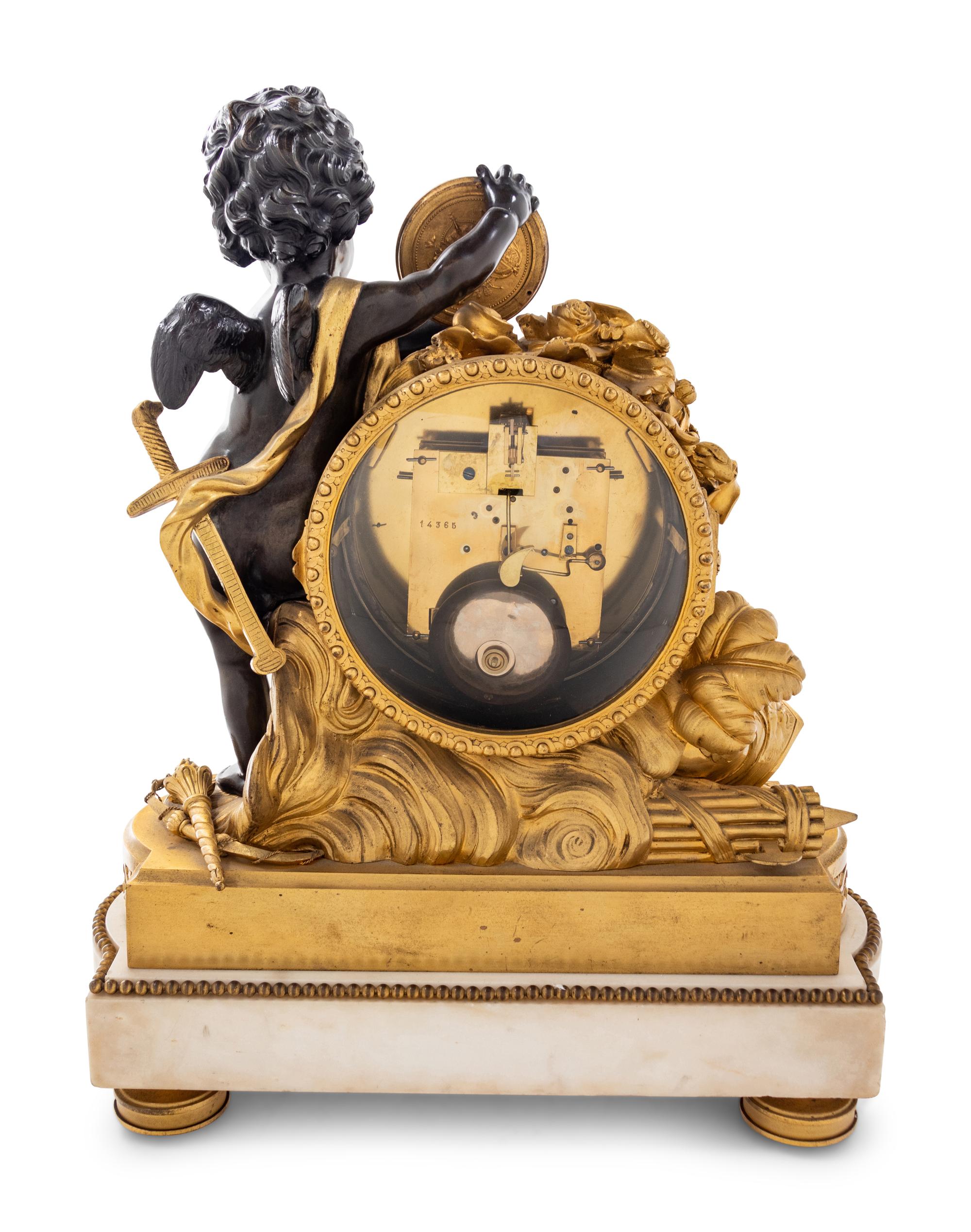 A Louis XVI Style Gilt and Patinated Bronze and Marble Clock