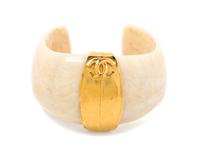 A Chanel Goldtone and Cream Cuff, 7" circumference.