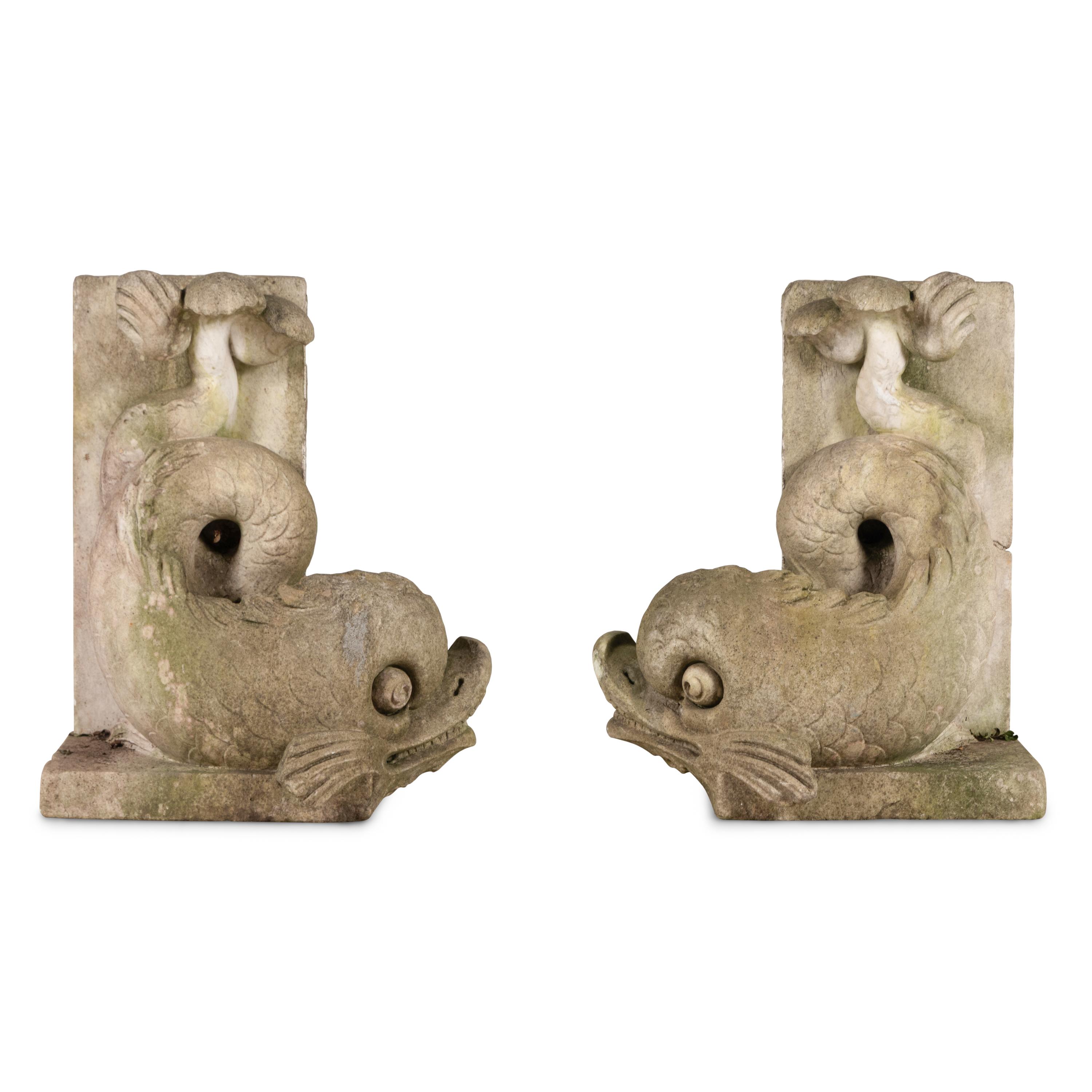 A Pair of Carved Stone Dolphins from Villa Turicum, Lake Forest, Illinois
