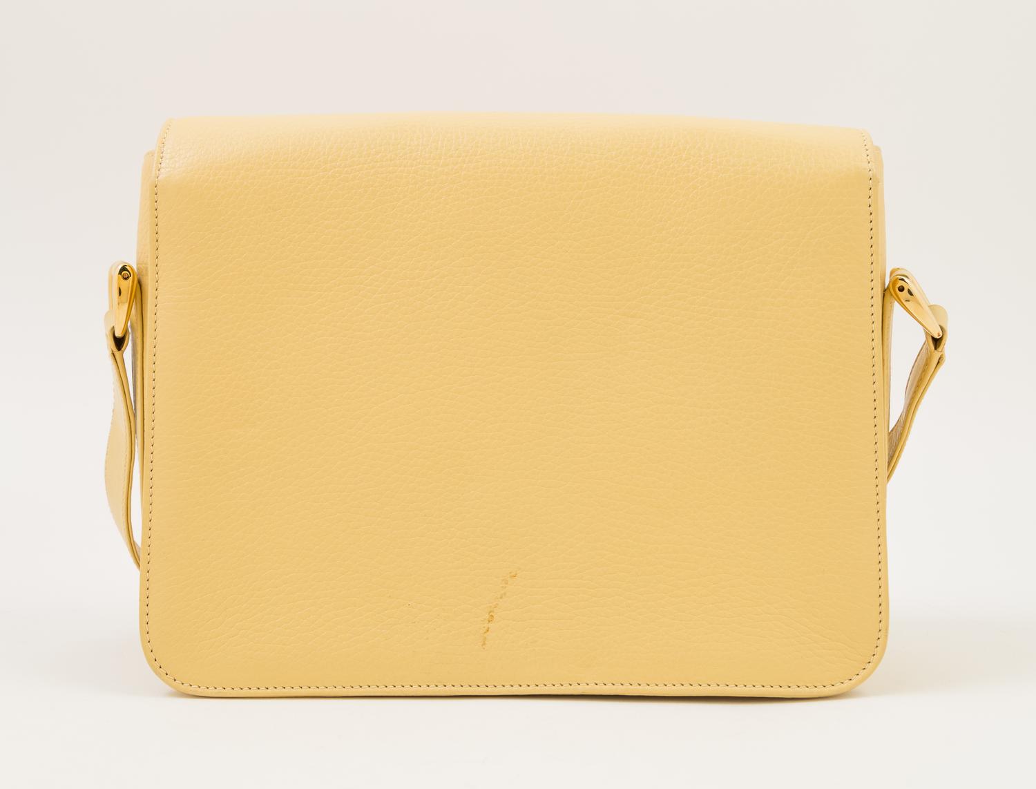 A Gucci Pale Yellow Leather Flap Handbag, 10" x 8" x 3"; Strap drop: 20".