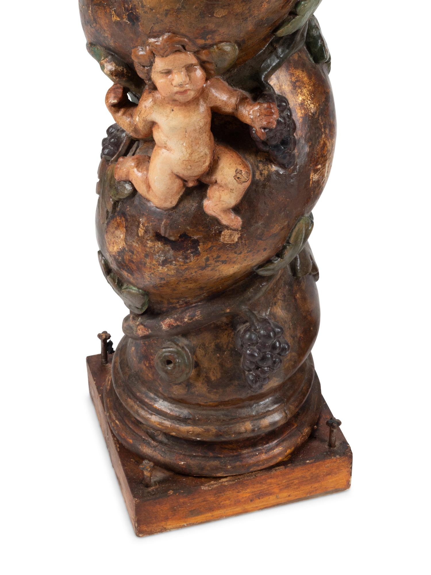 A Pair of Spanish Carved and Polychrome Decorated Solomonic Columns