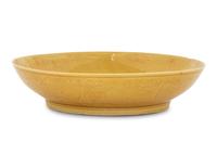 An Incised Yellow Glazed Porcelain 'Cranes and Pines' Plate