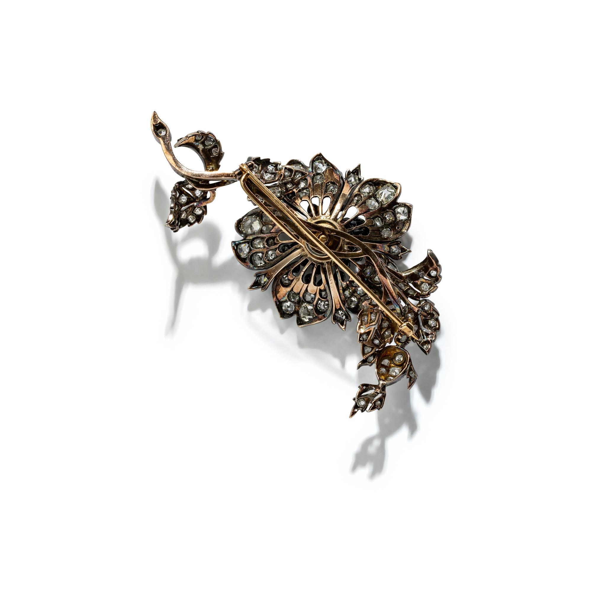 SILVER-TOPPED GOLD AND DIAMOND 'EN TREMBLANT' BROOCH