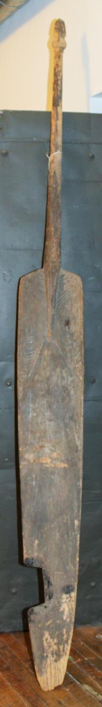 An Oceanic, Sepik River Canoe Paddle from Papua, New Guinea. Height 105 1/2 x width 10 1/2 x depth 2 1/4 inches.