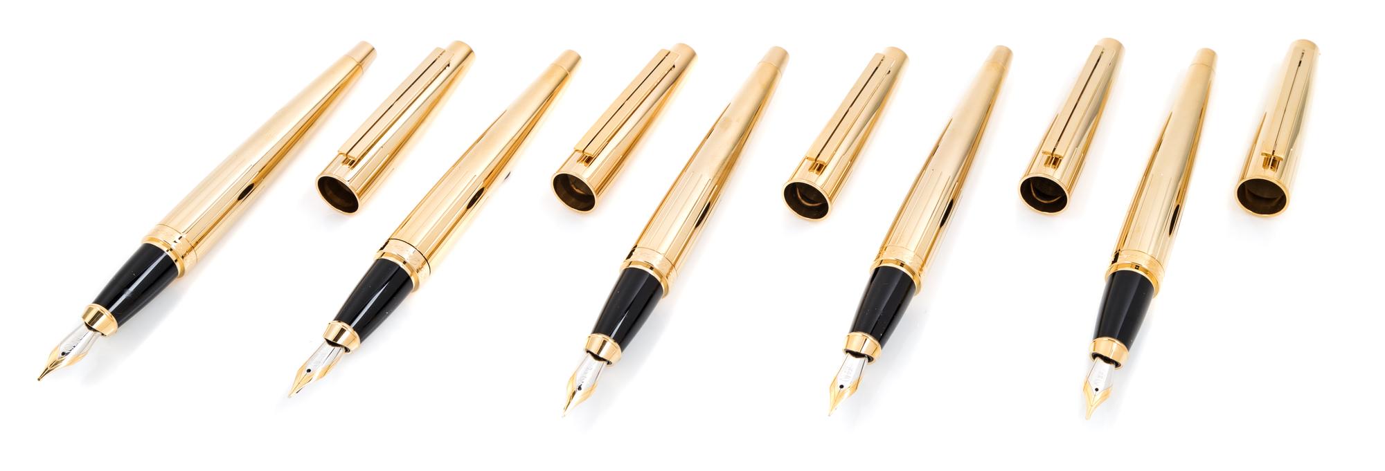 A Group of Five S.T. Dupont Gold-Plated Ellipsis Fountain Pens