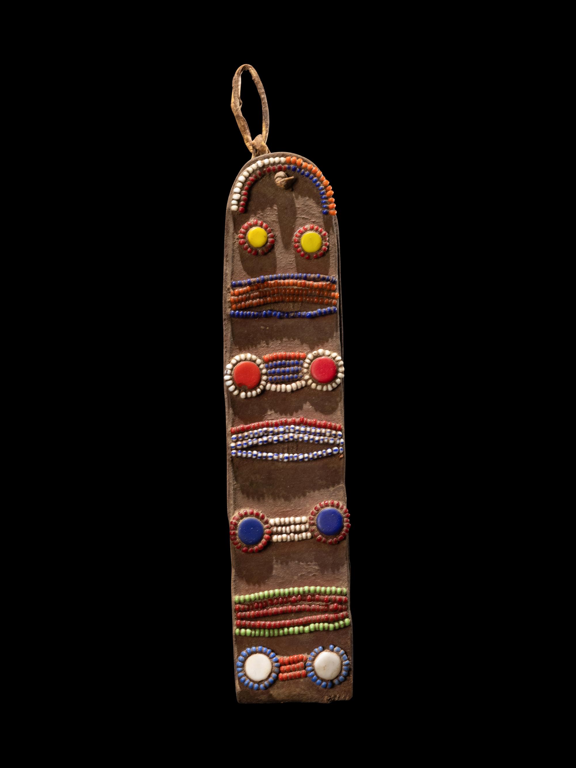 A Maasai Leather Hoop Decorated With Beads