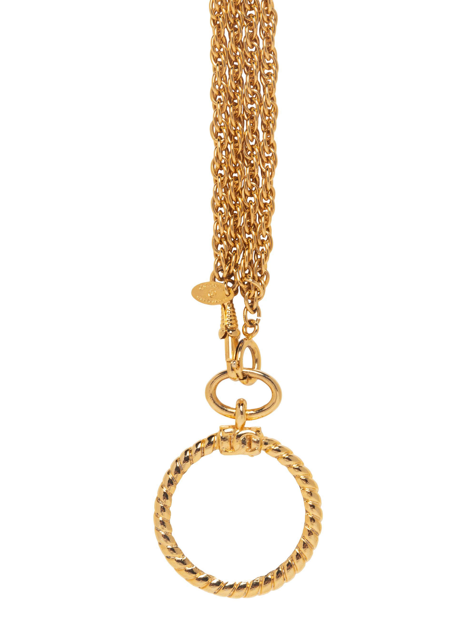 Chanel Magnifying Glass Necklace & Camellia