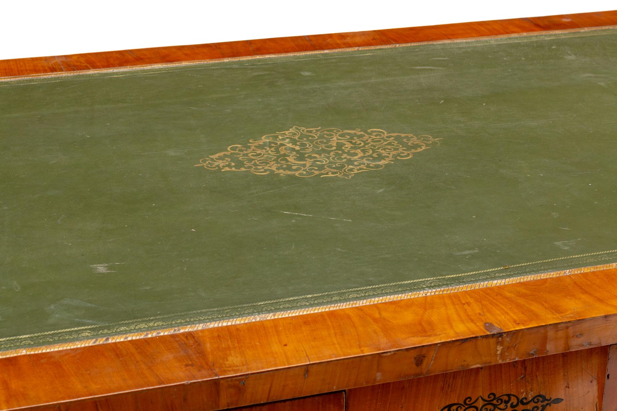 An Austrian Empire Style Fruitwood Veneered, Painted and Parcel Gilt Bureau Plat