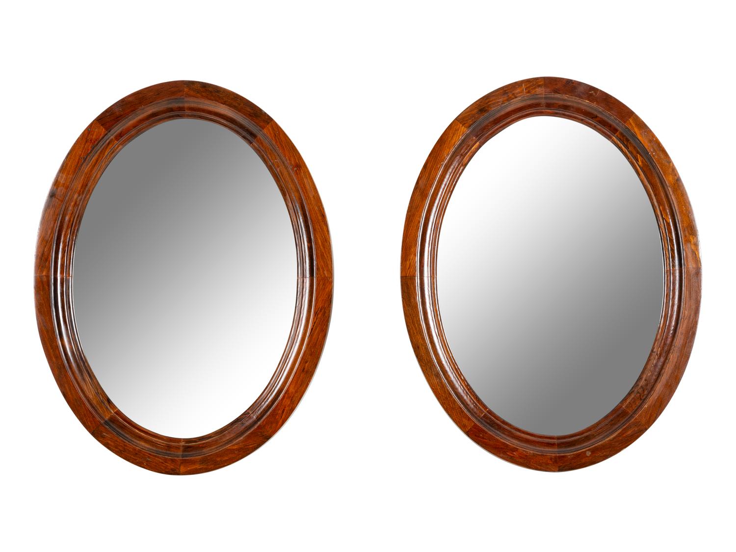 A Pair of Mahogany Oval Mirrors