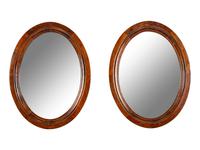 A Pair of Mahogany Oval Mirrors