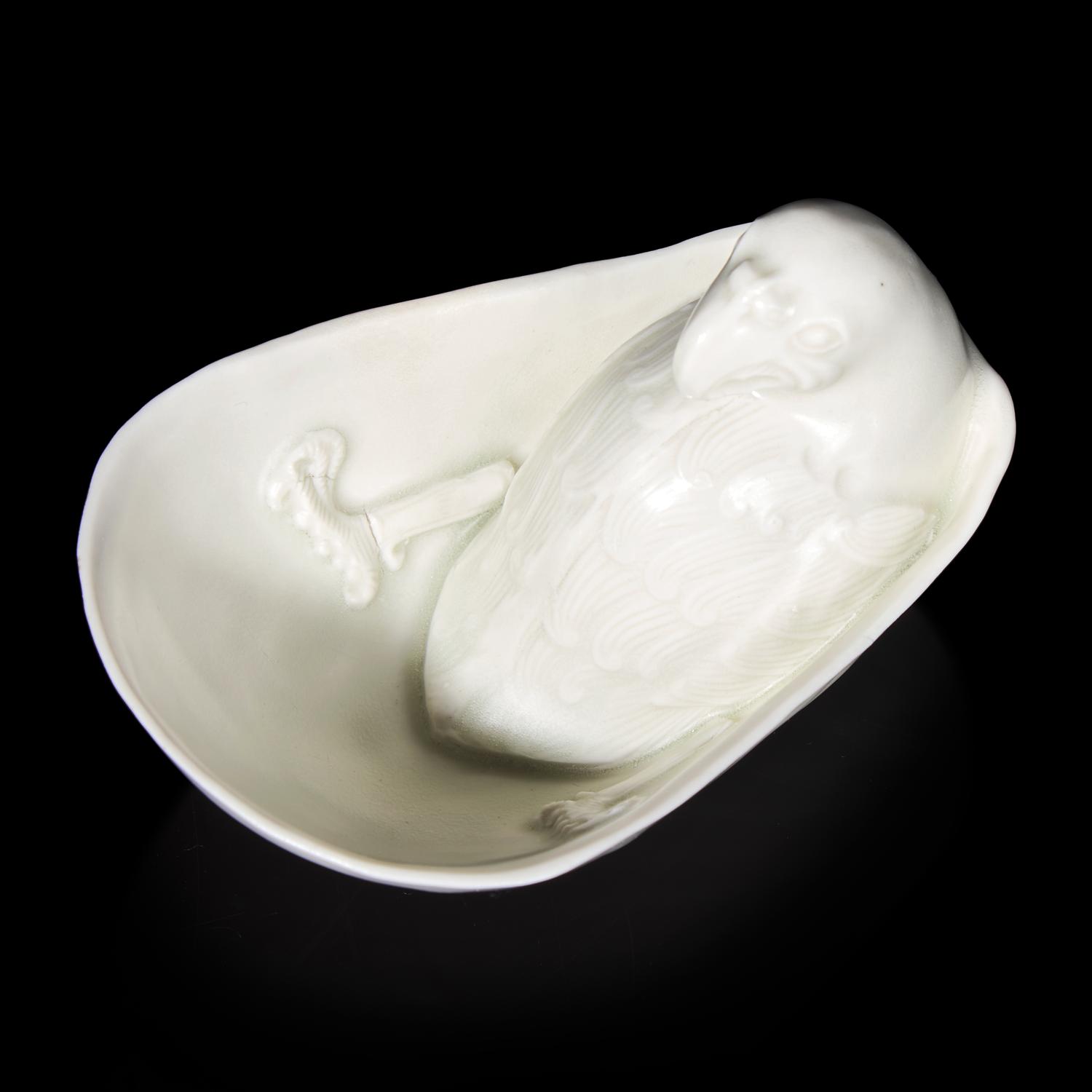 A Chinese Transparent Glazed 'Parrot' Cup, Song Dynasty 宋 白瓷鸚鵡杯