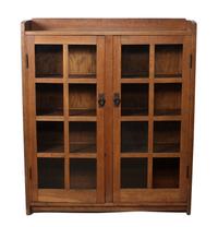 A Gustav Stickley Oak Two Door Bookcase Height 56 x width 47 1/2 x depth 13 inches — CIRCA 1912-1916