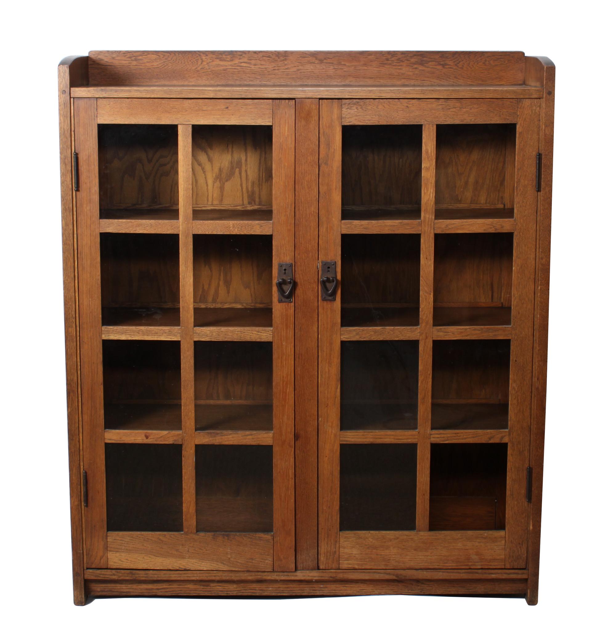 A Gustav Stickley Oak Two Door Bookcase Height 56 x width 47 1/2 x depth 13 inches — CIRCA 1912-1916