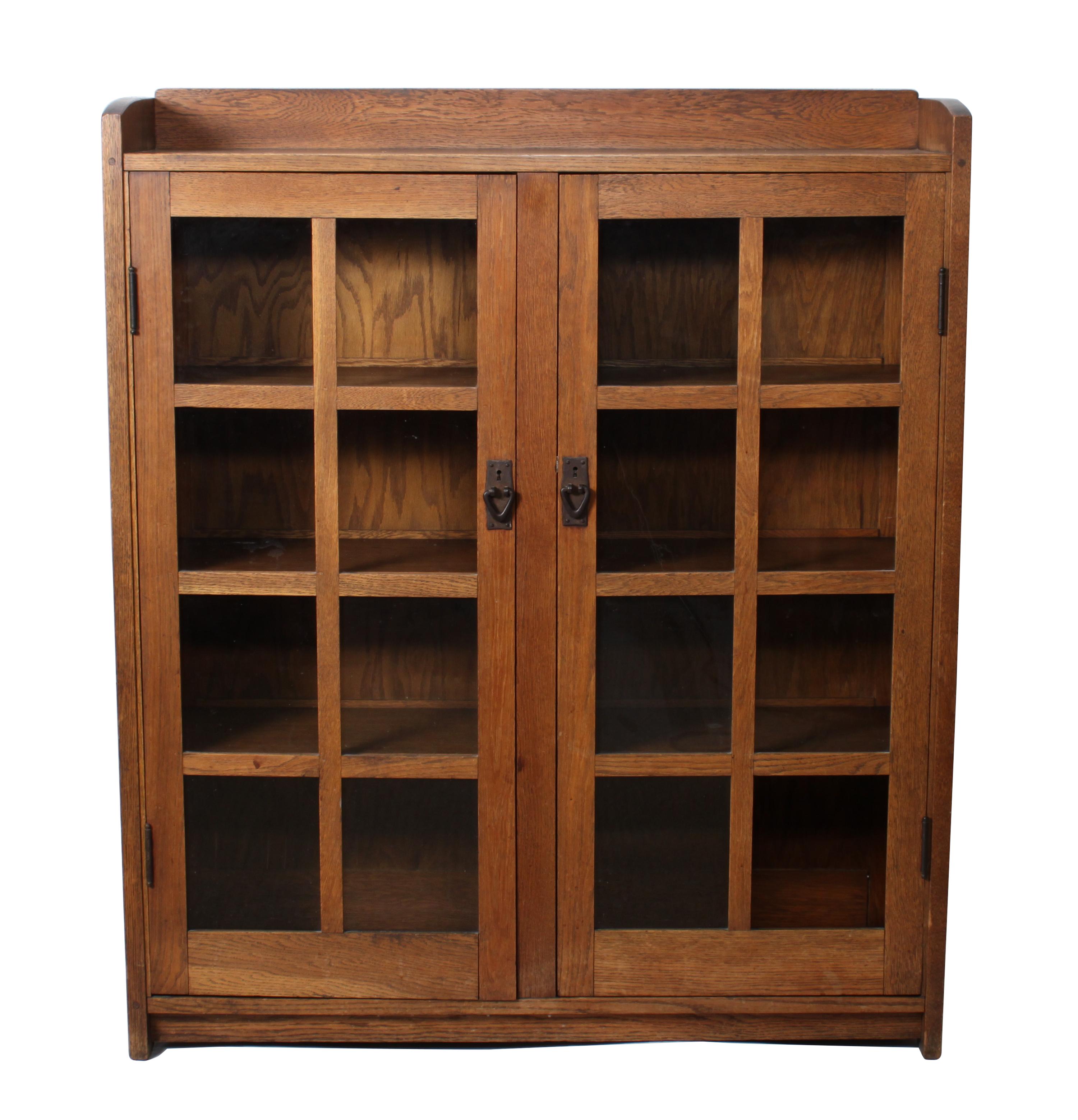 A Gustav Stickley Oak Two Door Bookcase Height 56 x width 47 1/2 x depth 13 inches — CIRCA 1912-1916