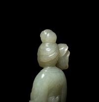 A Chinese Carved Pale Celadon Jade Standing Female Figure