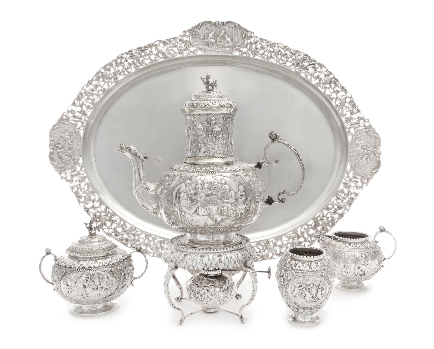 A Dutch Silver Four-Piece Tea Service, Maker's Mark VS, Amsterdam, 1917, comprising a teapot with burner and stand, creamer, covered su
