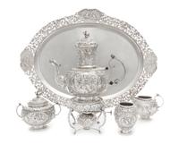 A Dutch Silver Four-Piece Tea Service, Maker's Mark VS, Amsterdam, 1917, comprising a teapot with burner and stand, creamer, covered su