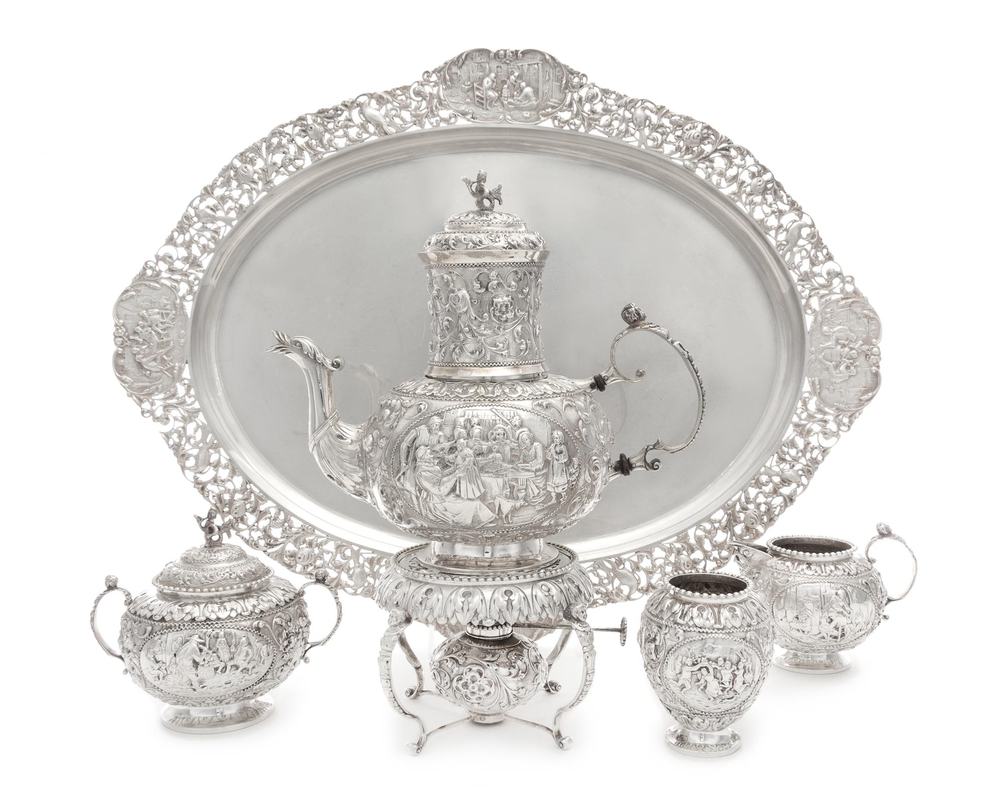 A Dutch Silver Four-Piece Tea Service, Maker's Mark VS, Amsterdam, 1917, comprising a teapot with burner and stand, creamer, covered su