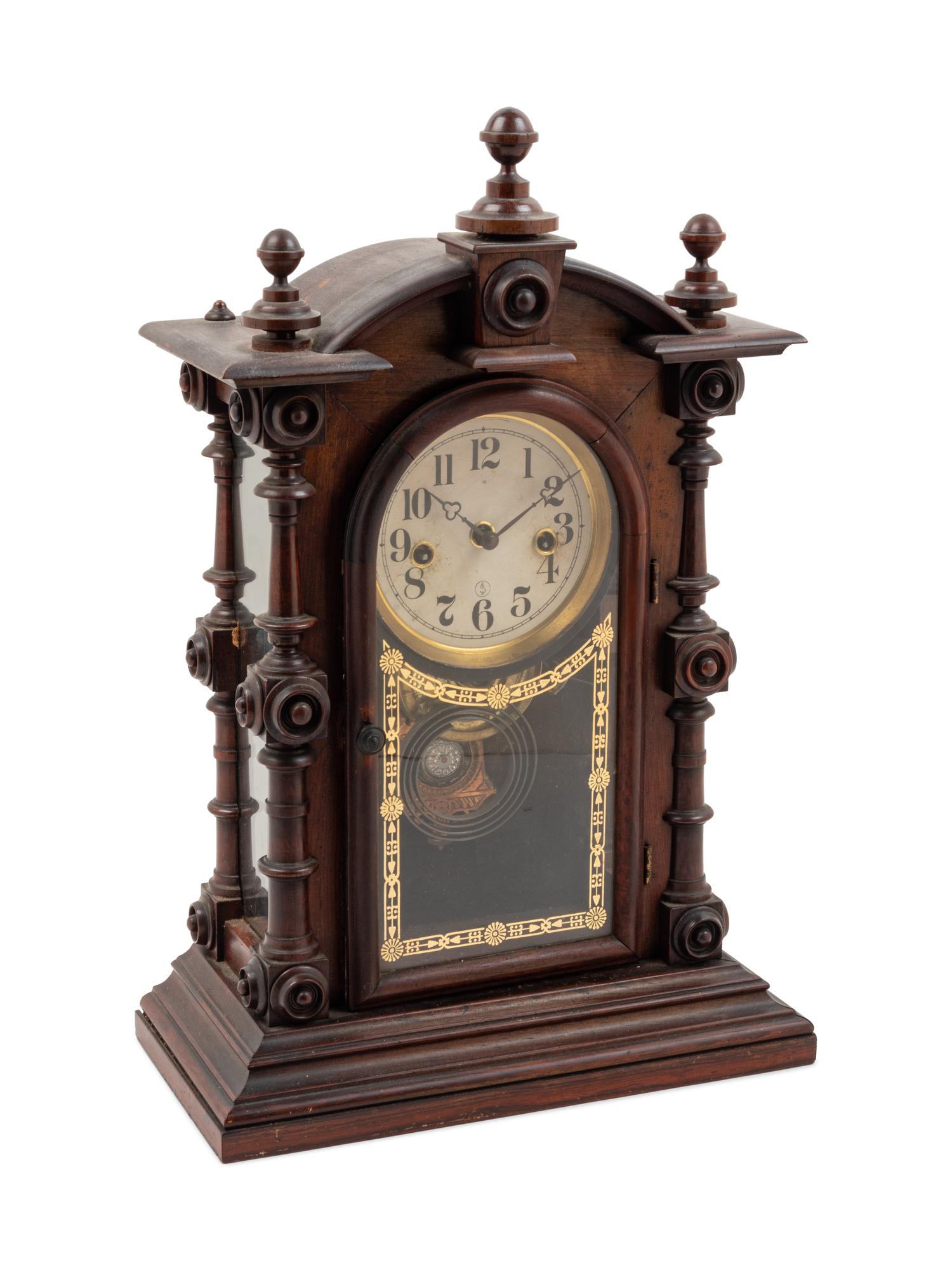 A Victorian Walnut Mantel Clock