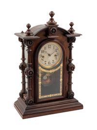 A Victorian Walnut Mantel Clock