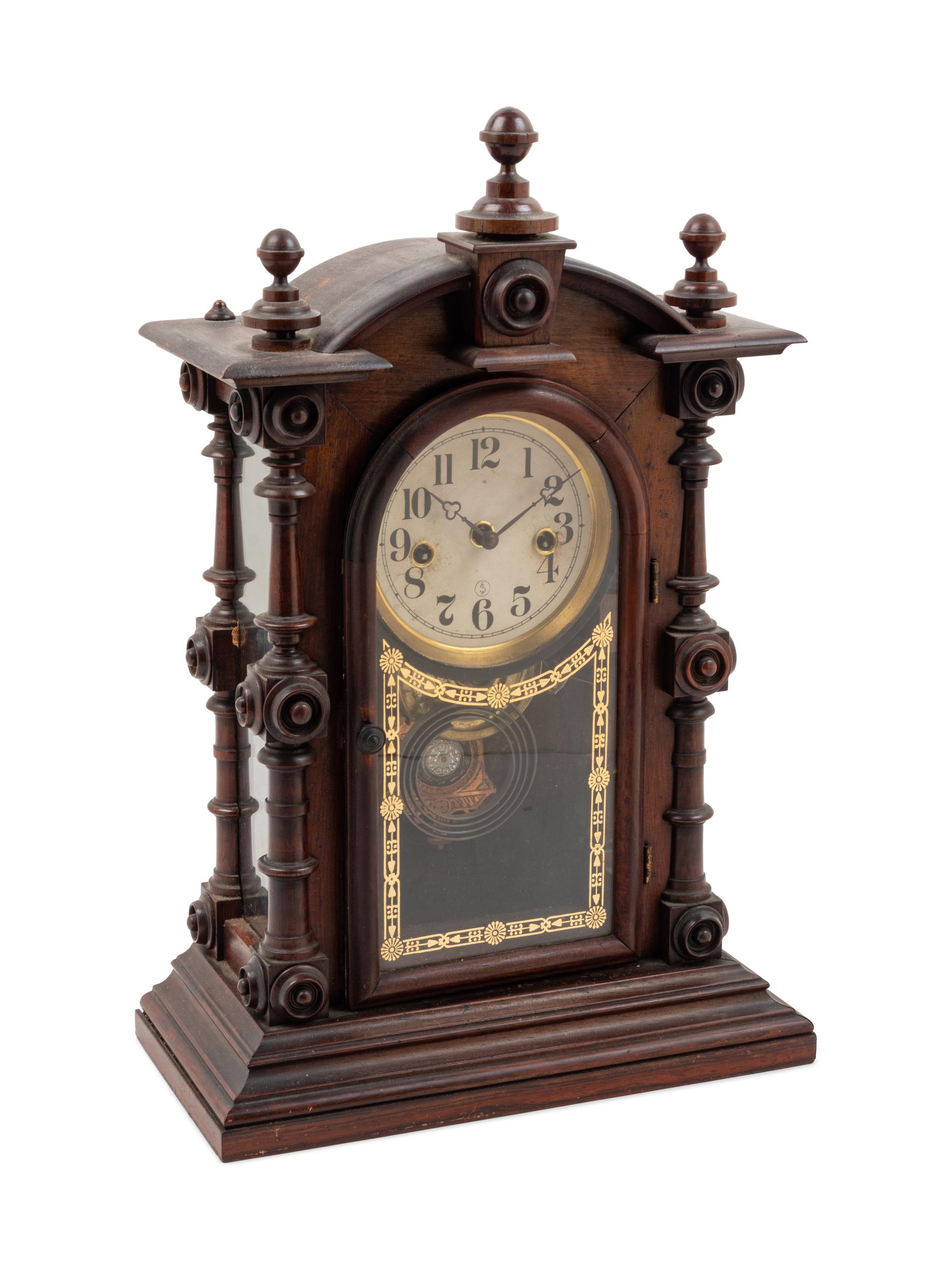 A Victorian Walnut Mantel Clock