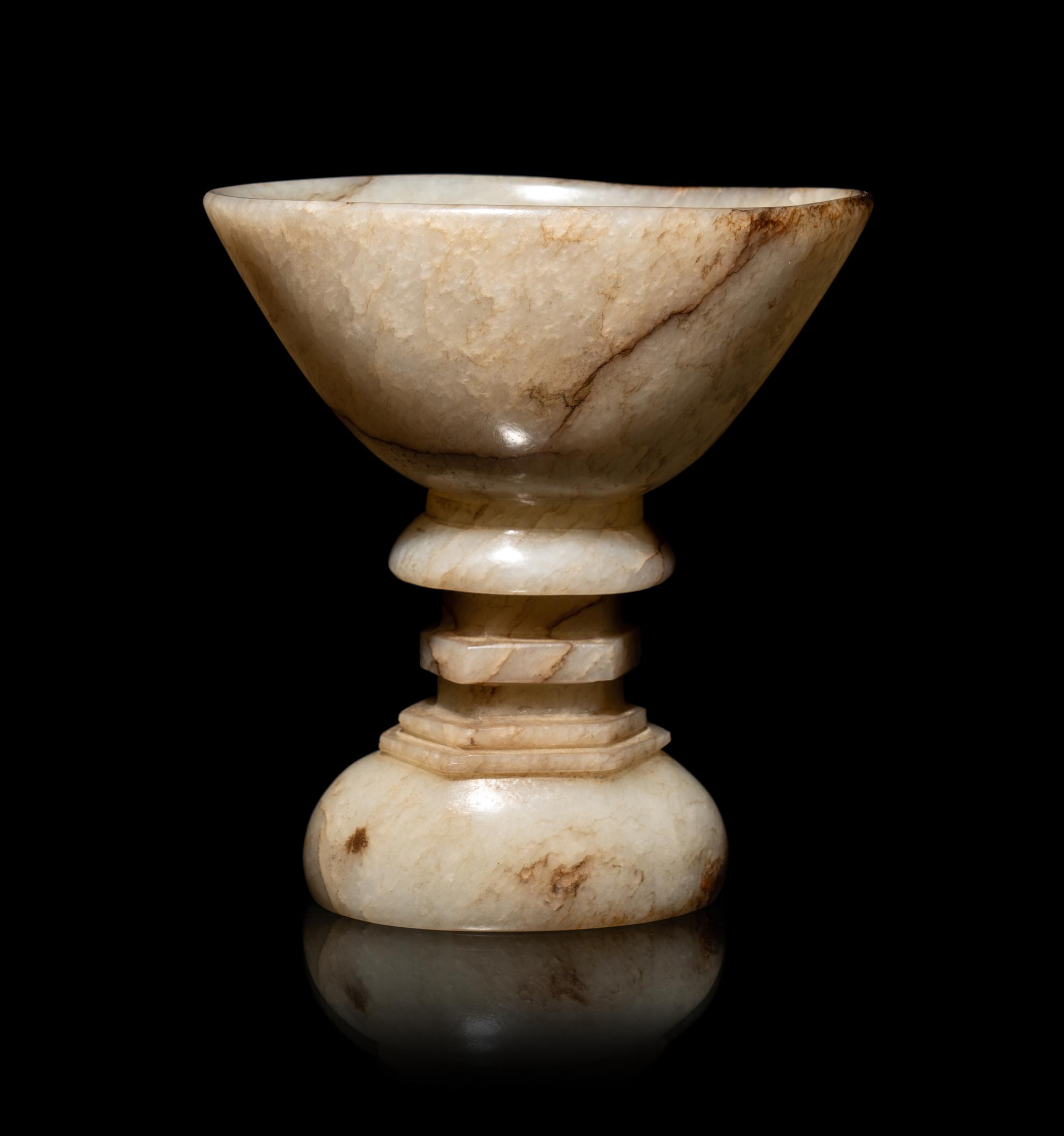 A Chinese Dark Russet White Jade Offering Bowl