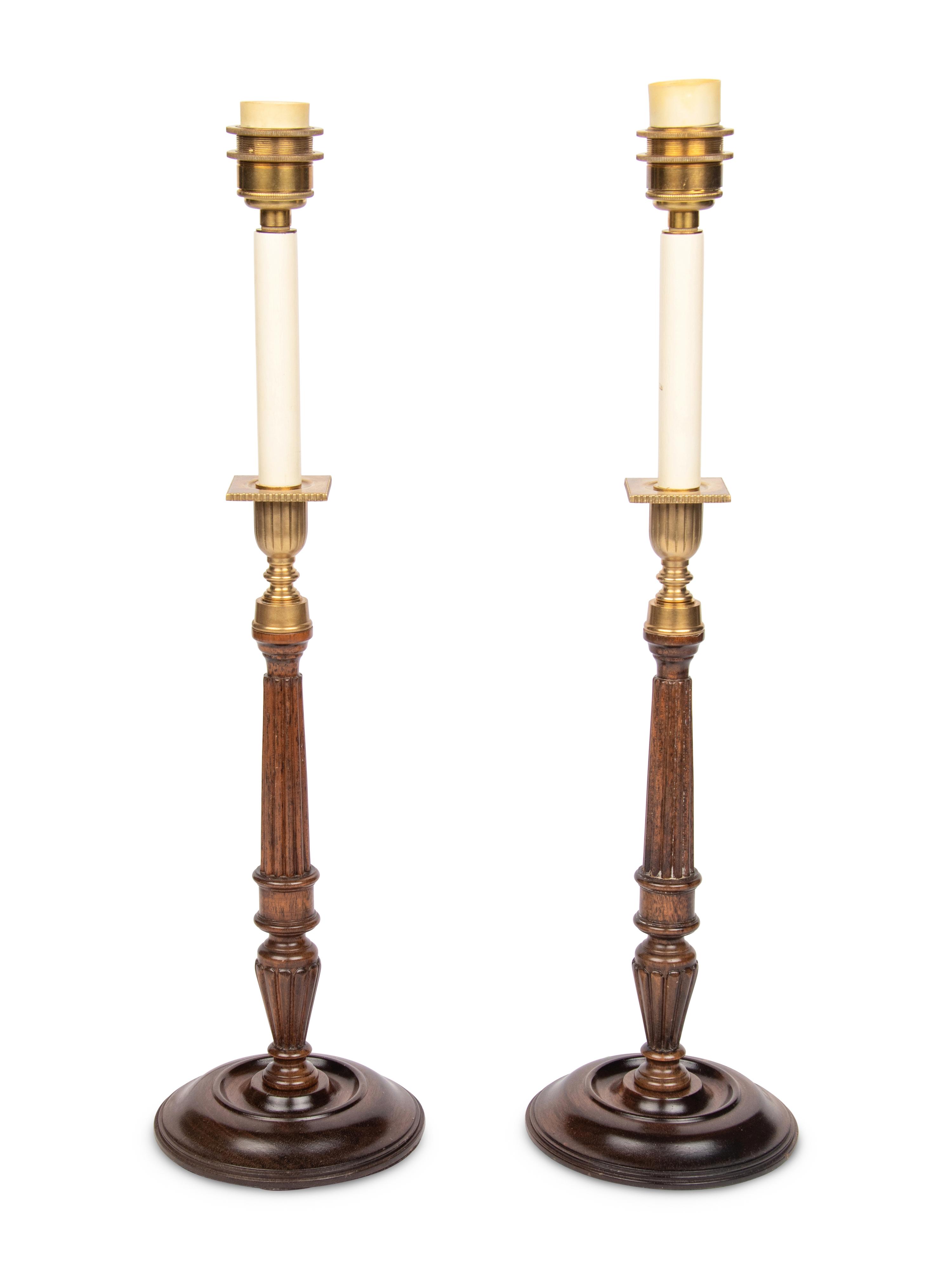 A Pair of Brass Mounted Mahogany Candlesticks