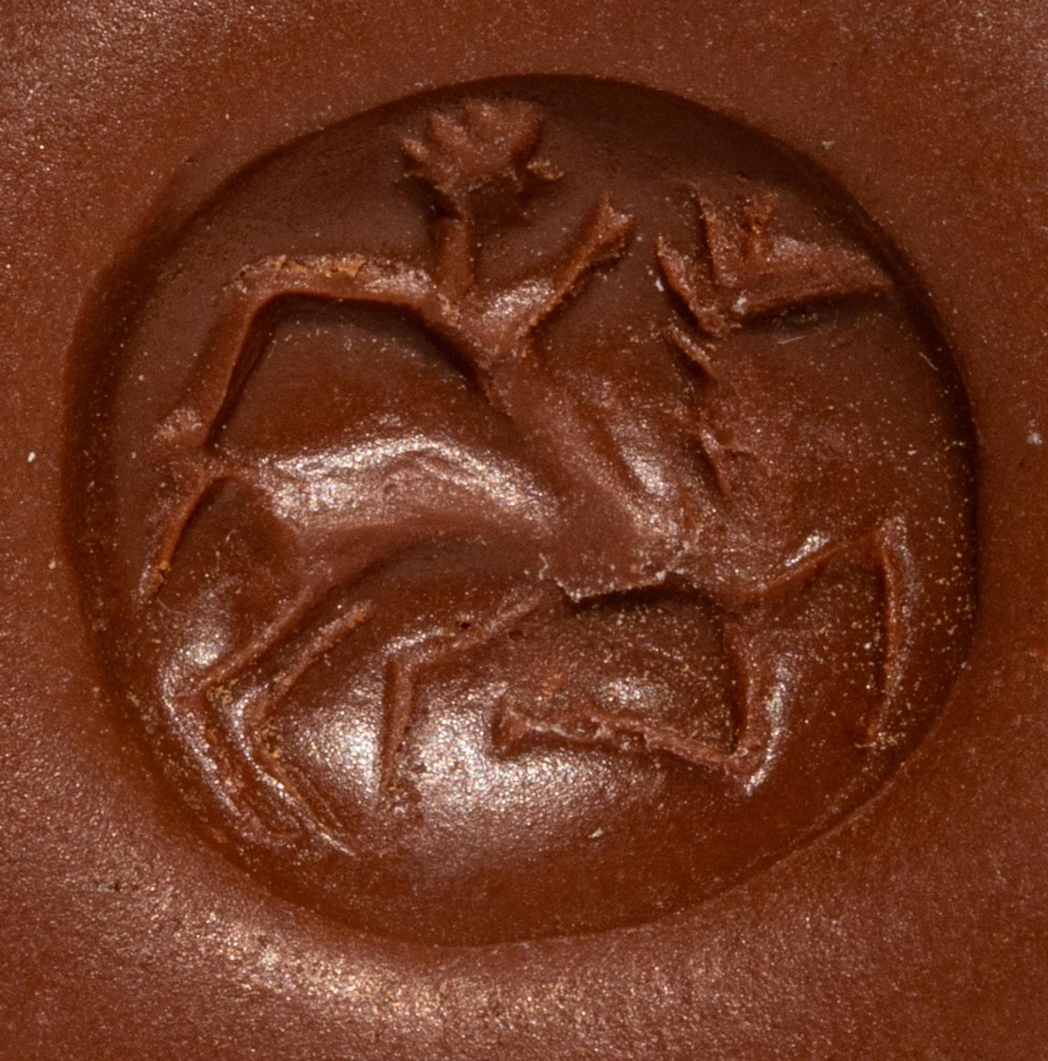 A Minoan Pale Green Steatite Lentoid with a Figure on Horseback