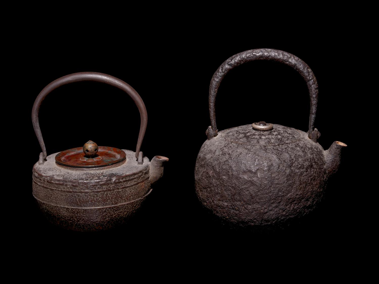 Seven Japanese Cast Iron Teapots, Tetsubin, and Burner