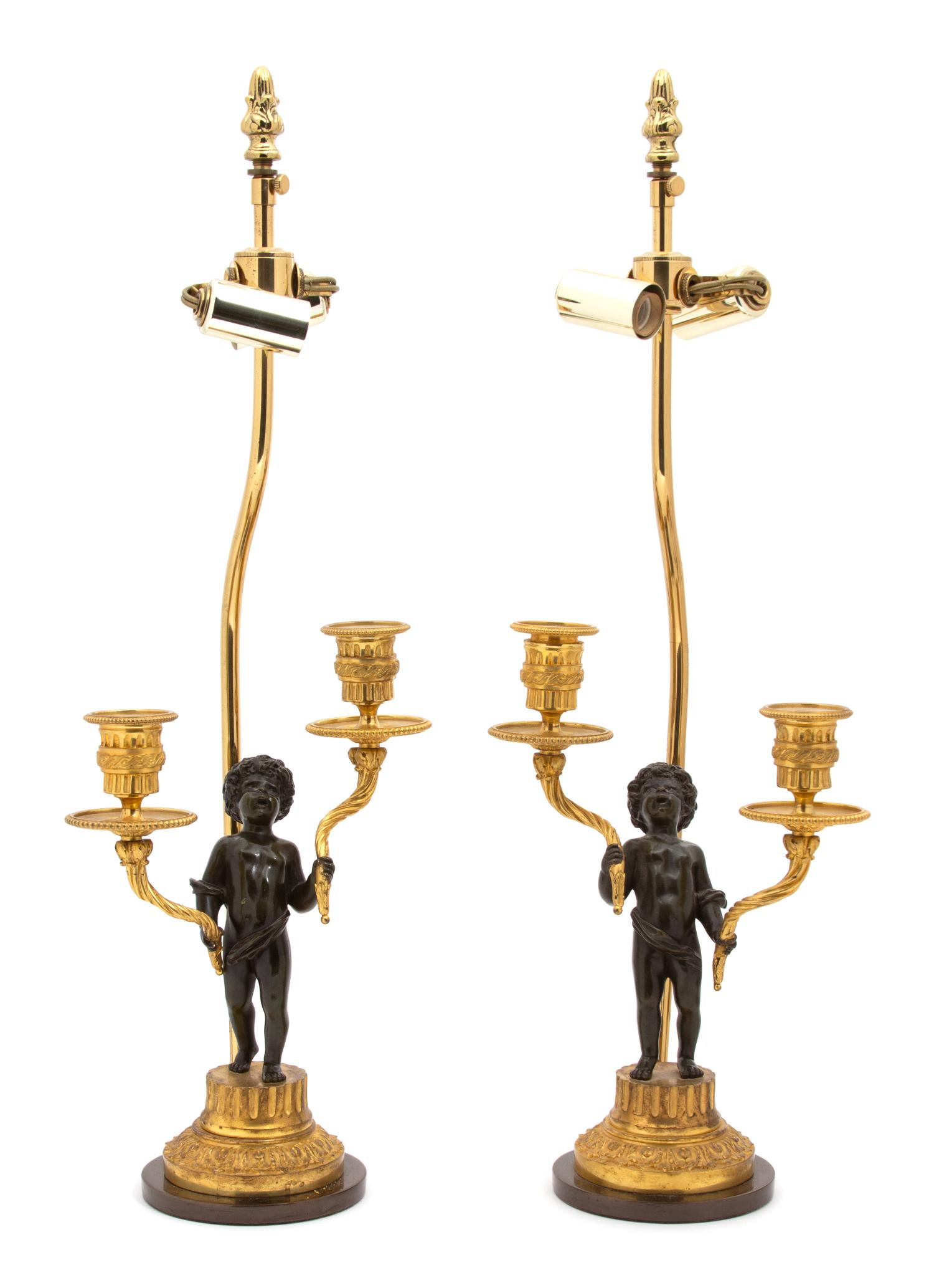 A Pair of French Parcel-Gilt and Patinated Bronze Two-Light Figural Candelabra Height of candelabra 11 inches. — 19TH CENTURY