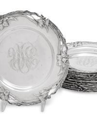 A Set of Twelve American Arts and Crafts Silver Bread Plates