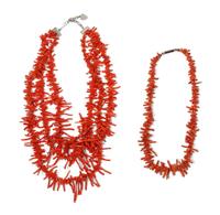 A Three Strand Branch Coral Necklace Length of longest 30 inches.