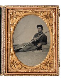 [CIVIL WAR]. Quarter plate tintype of a Union private reclining with his Springfield Pattern 1861 musket.