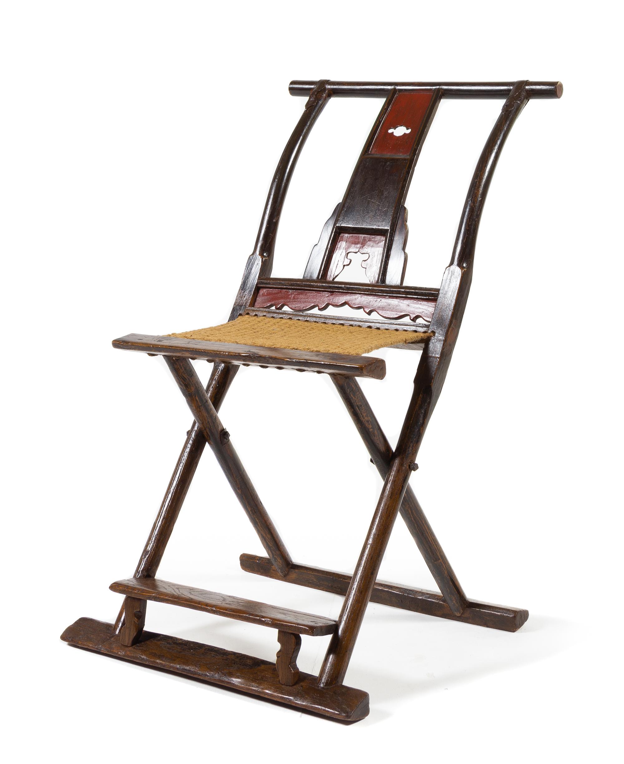 A Chinese Elmwood Folding Chair, Jiaoyi Height 37 1/4 x width 22 1/2 x depth 27 inches. — 19TH CENTURY